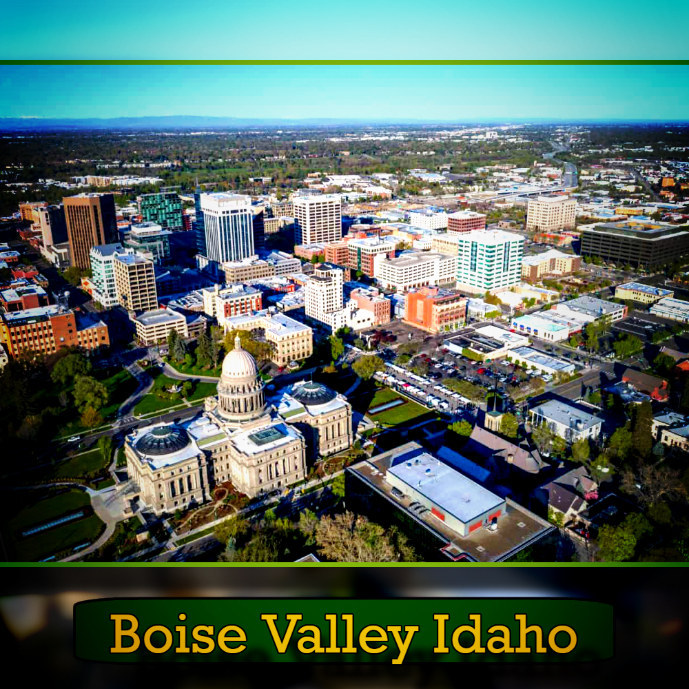 Aerial view of Boise, Idaho, highlighting the state capitol building and surrounding cityscape, with a tow truck navigating the streets below. Text at the bottom reads "Boise Valley Idaho.